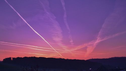 Low angle view of vapor trails in sky