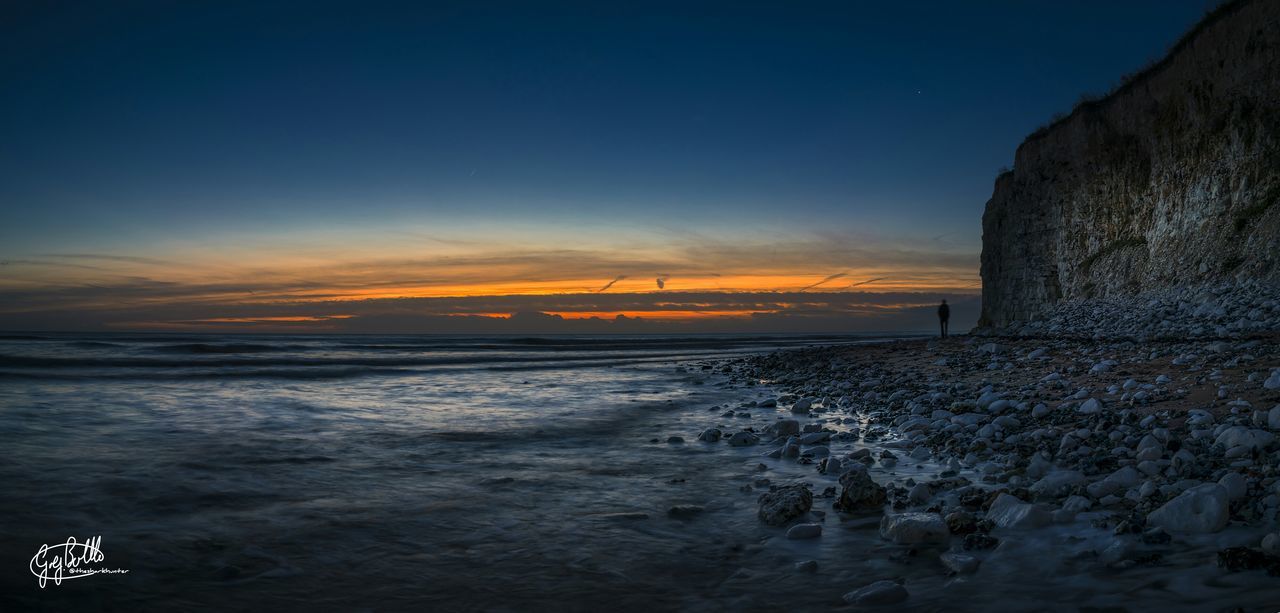 VIEW OF SEA AT SUNSET