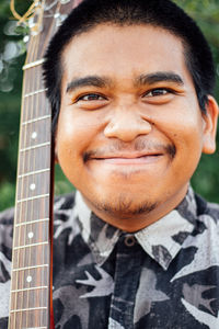 Close-up portrait of a smiling young man