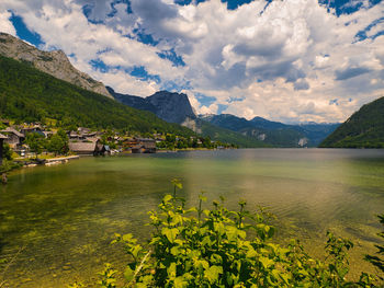 Scenic view of lake and mountains against sky