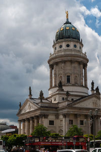 Low angle view of building against cloudy sky