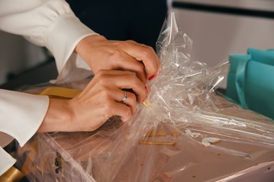 Woman hands wrapping gift box