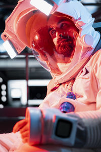 Close-up of man with toy