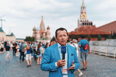 Full length of man standing in temple against building