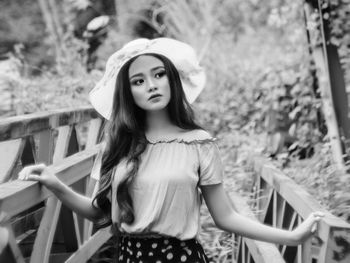 Portrait of a smiling young woman standing outdoors