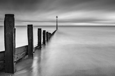 Scenic view of sea against cloudy sky