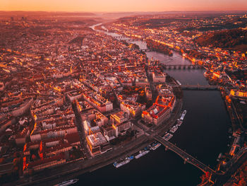 High angle view of illuminated buildings in city at night