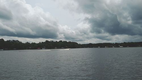 Scenic view of sea against cloudy sky