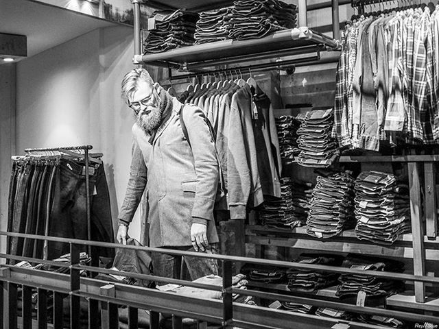 indoors, retail, large group of objects, working, men, for sale, shelf, occupation, abundance, variation, in a row, choice, hanging, order, store, shop, business, stack