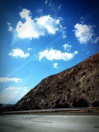 Scenic view of mountains against cloudy sky