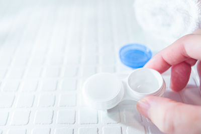 Midsection of person holding camera