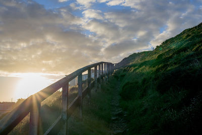 Scenic view of bridge against sky during sunset