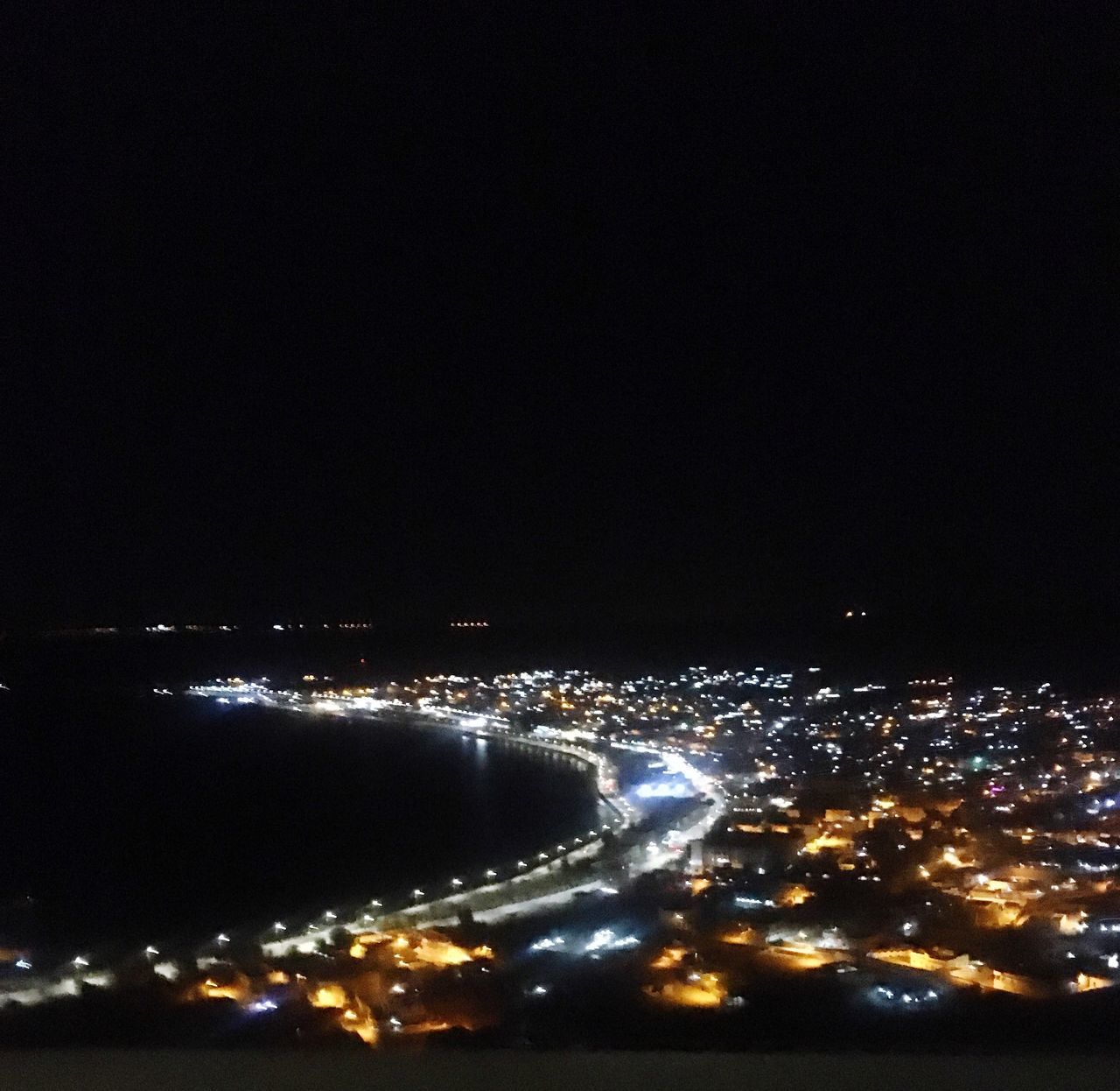 illuminated, night, architecture, building exterior, city, built structure, cityscape, no people, copy space, sky, high angle view, nature, outdoors, building, water, glowing, aerial view, travel destinations, lighting equipment, dark, nightlife