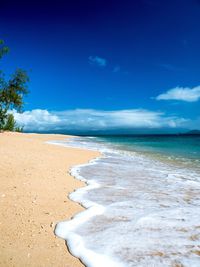 View of beach against cloudy sky