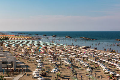 High angle view of people on beach against sky