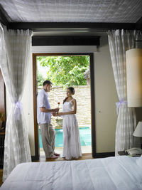 Man proposing woman at hotel room