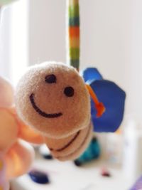 Close-up of hand holding toy