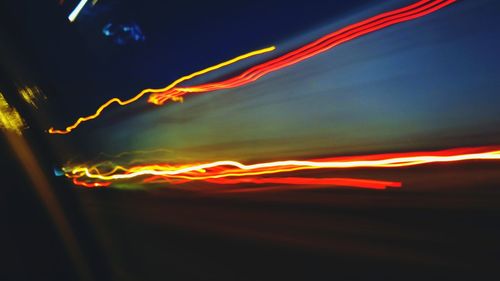 Low angle view of illuminated sky at night