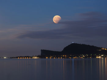 Scenic view of sea against sky at night