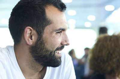 Close-up portrait of young man looking away