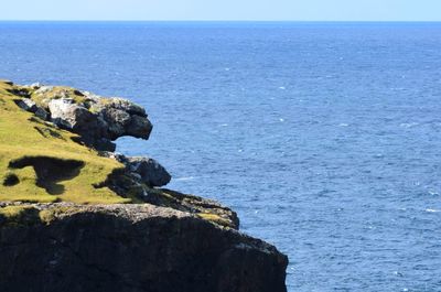 Scenic view of sea against clear blue sky