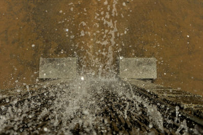 Close-up of wet road during winter