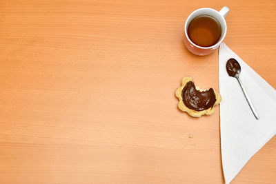 High angle view of coffee cup on table
