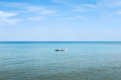 Boat in sea against sky