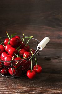 Fresh cherries, summer fruits, red sweet cherries in a metal basket