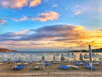 Scenic view of beach against sky during sunset