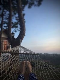 Laying on large hammock in early morning