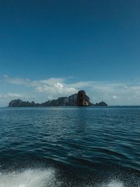 Scenic view of sea against blue sky