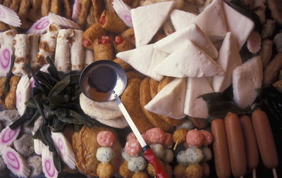 Directly above view of ladle on sweet food at store