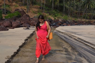 Full length of woman standing on land