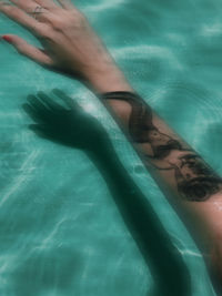High angle view of woman swimming in pool