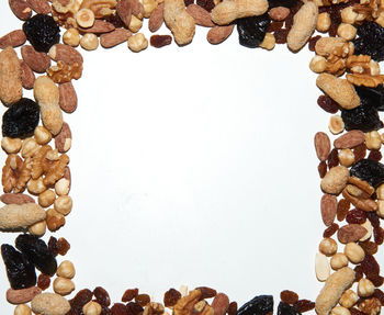 Directly above shot of breakfast on table against white background