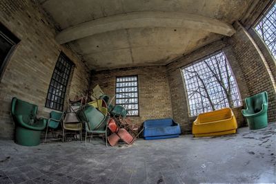 Fish-eye view of scrap furniture in abandoned building