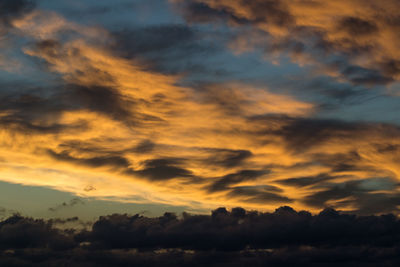 Low angle view of dramatic sky during sunset