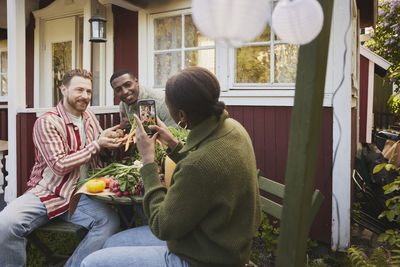 Friends sitting in garden