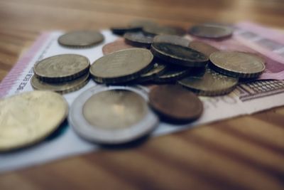 Close-up of coins on table