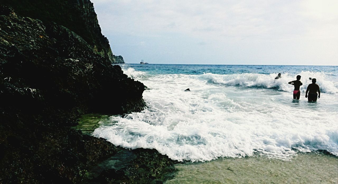 sea, water, horizon over water, beach, leisure activity, lifestyles, wave, men, shore, vacations, sky, scenics, beauty in nature, person, surf, tourist, nature, medium group of people, enjoyment