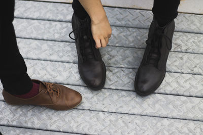 Low section of men standing on floor