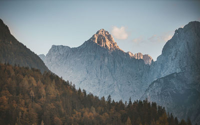 Panoramic view of trees and mountains against sky