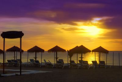 Scenic view of beach against sky during sunset