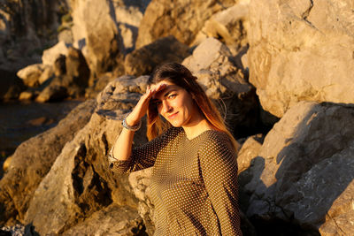 Woman standing on rock