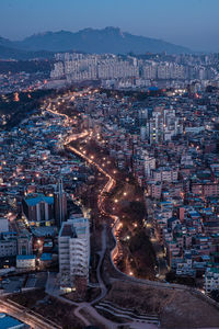 High angle view of illuminated buildings in city at night