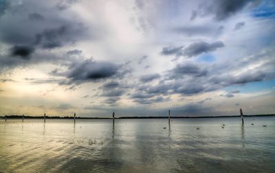 Scenic view of sea against cloudy sky