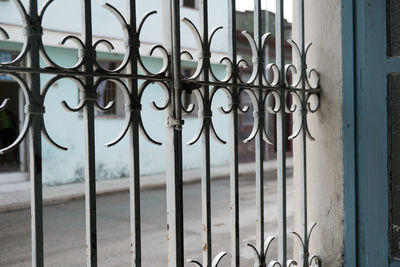 Metal gate against building