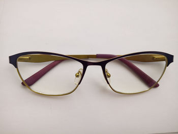 Close-up of sunglasses against white background