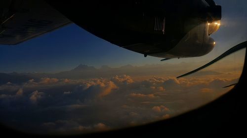 Aerial view of mountains against sky during sunset